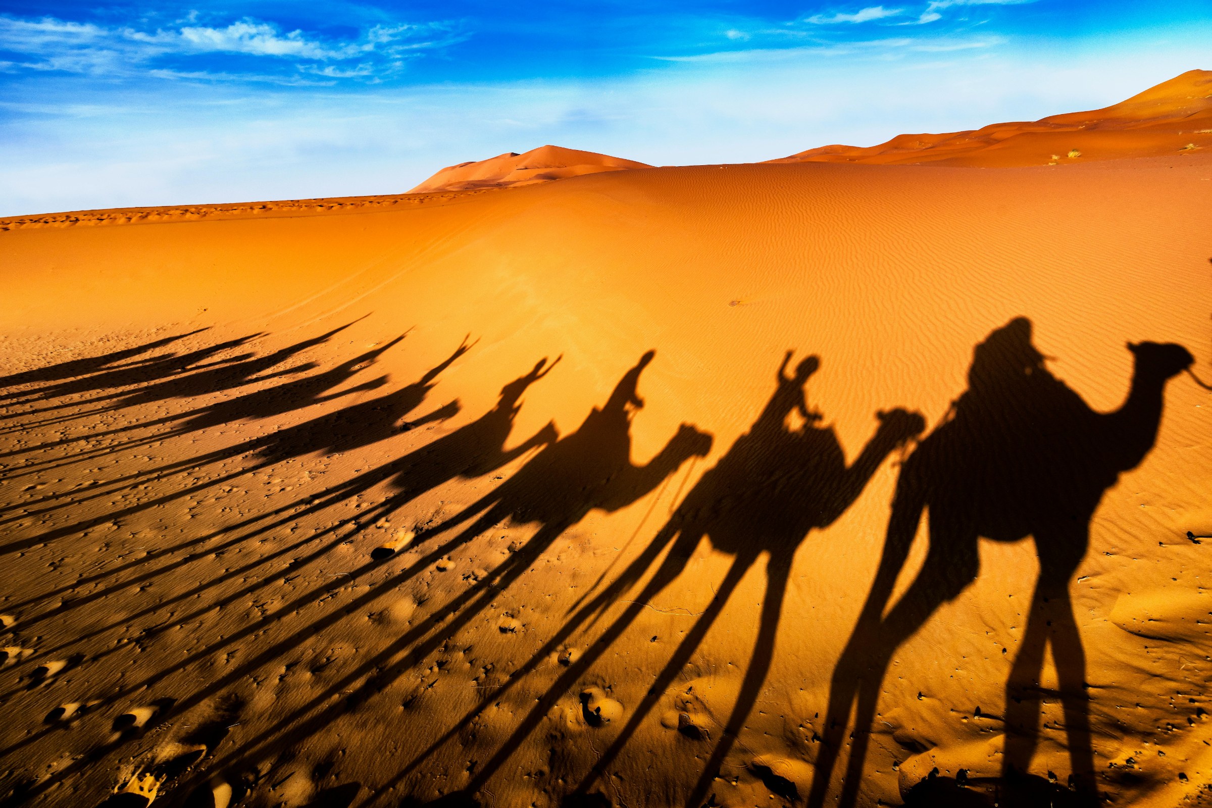 Luxury Sahara desert camp near Merzouga, with Erg Chebbi dunes, camel ride, sunset and private Morocco desert experience.