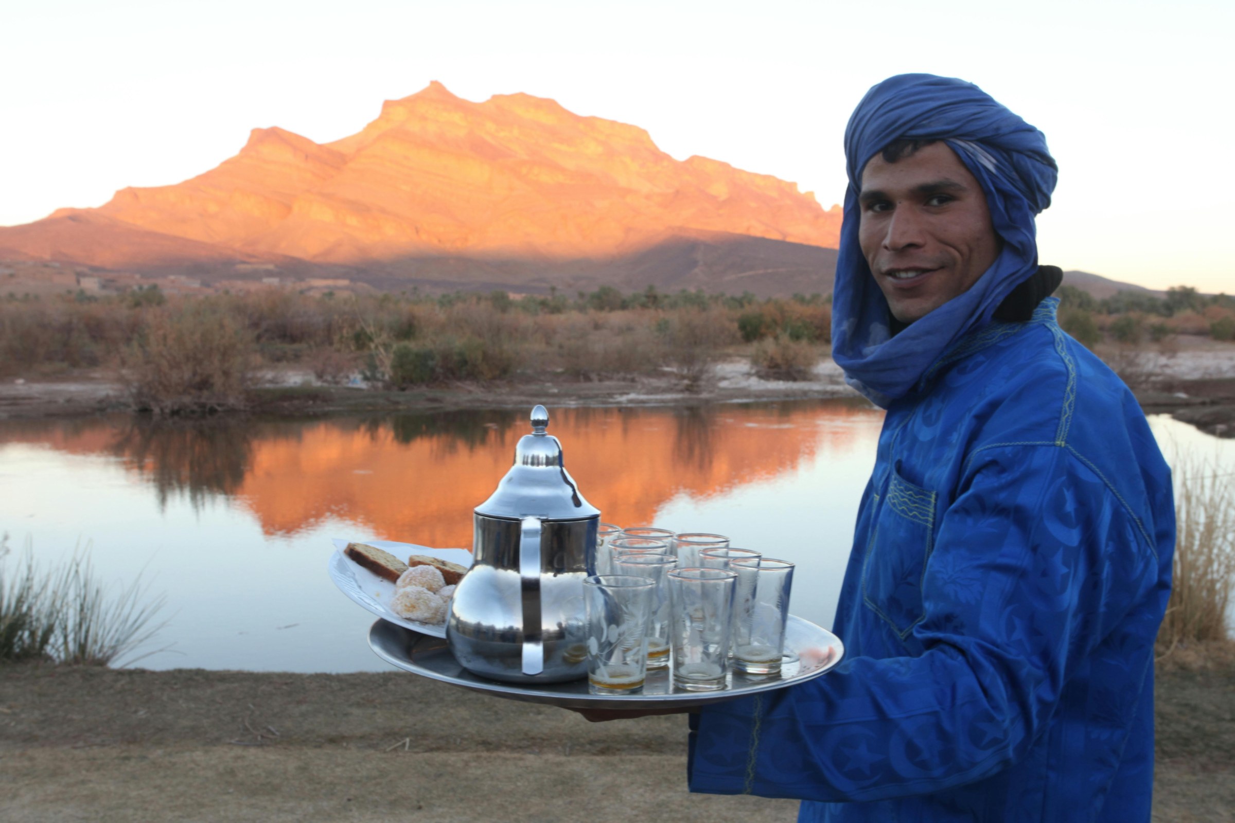 Road from Merzouga to Nkob or Agdz, crossing desert-edge landscapes, oasis villages and southern Morocco kasbah scenery.