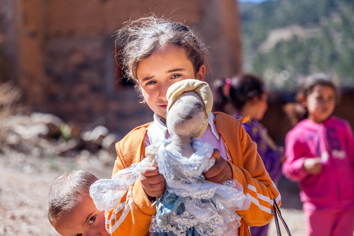 Women’s cooperative and village walk in Aït Bouguemez, with Berber families, terraced fields and cultural exchange.