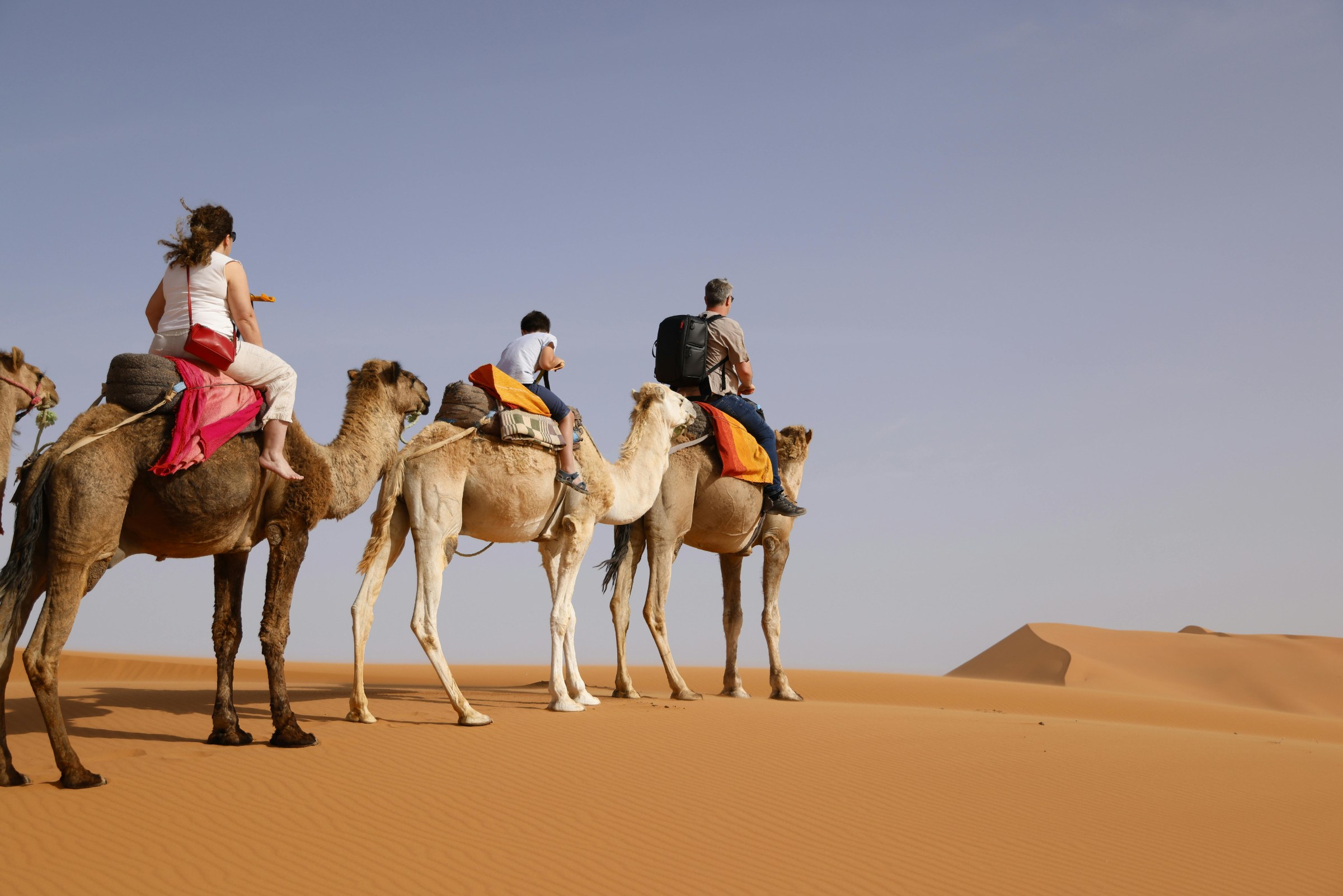 Sunrise over Erg Chebbi dunes in Merzouga, with soft adventure activities, Gnaoua music and Sahara landscapes.