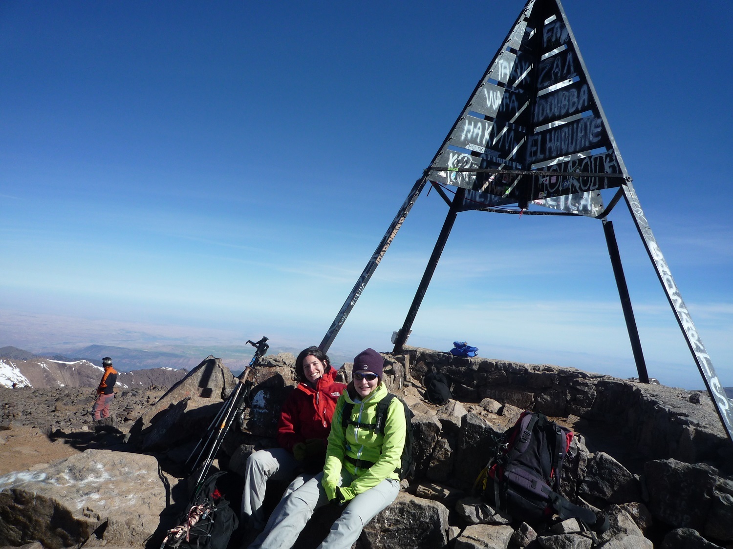 Mount Toubkal summit ascent in Morocco, with panoramic High Atlas views and guided trekking support from Imlil.