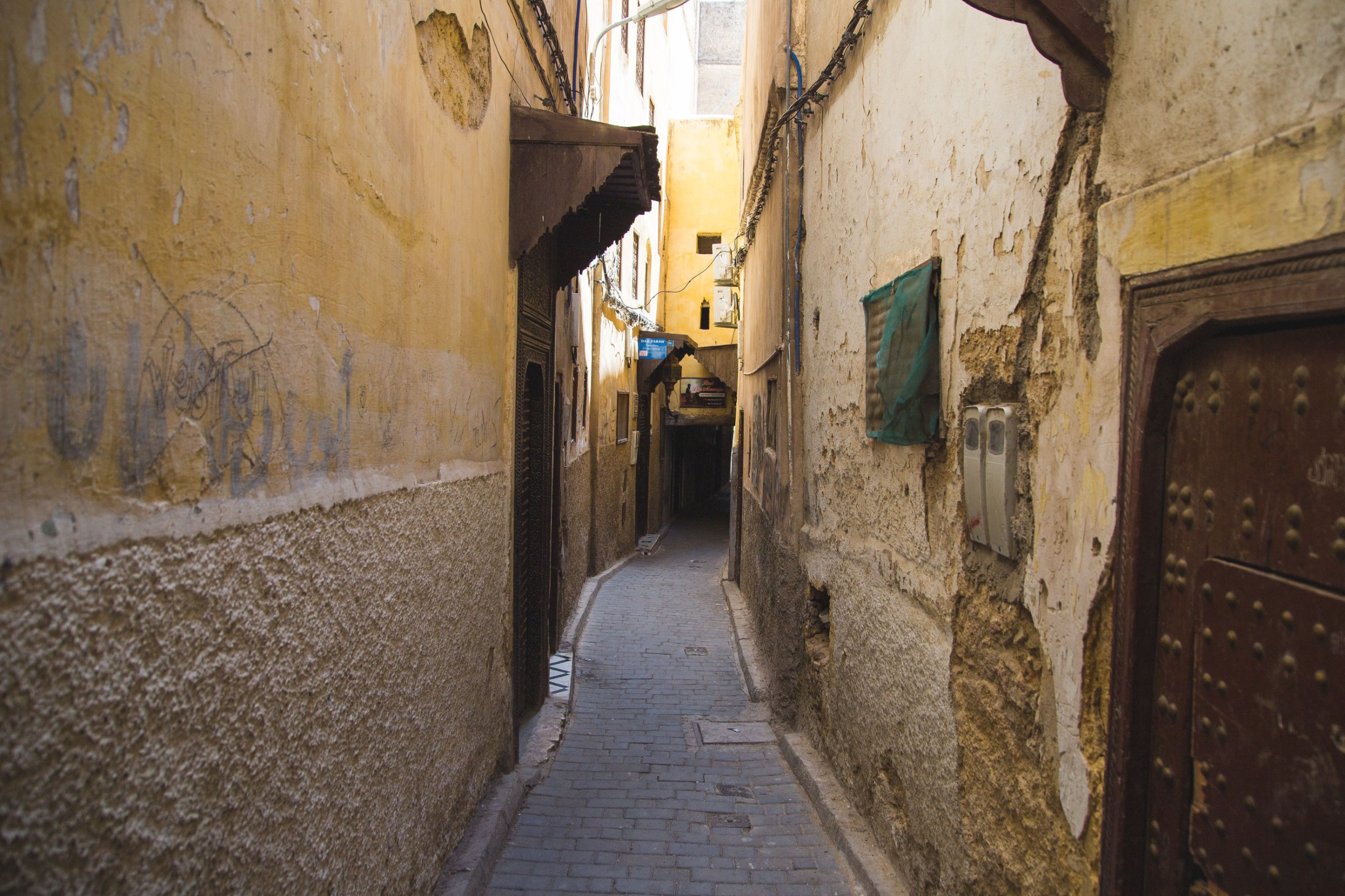 Return from the High Atlas to Marrakech with local village encounters, cooperative visit and optional artisan workshop in Morocco.