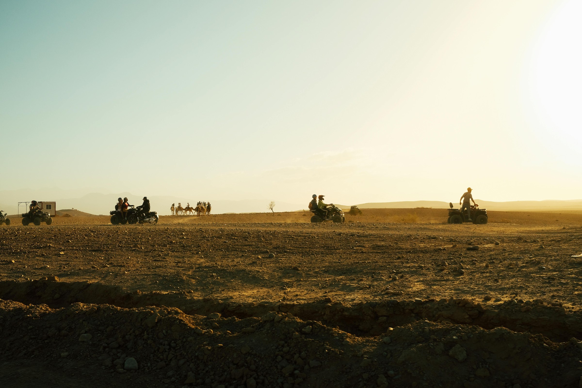 Family desert camp experience in Agafay near Marrakech, with camel ride, sunset views and Atlas Mountain scenery.