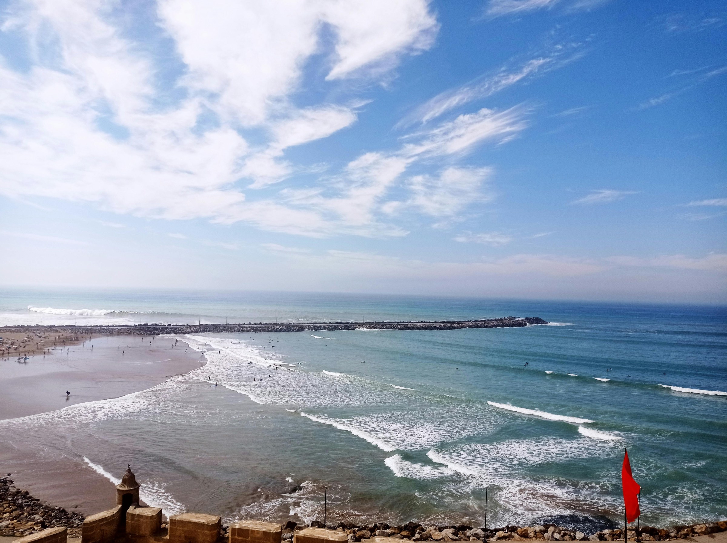 Arrival in Essaouira during a women’s wellness retreat, with Atlantic coast, whitewashed medina and slow travel atmosphere.